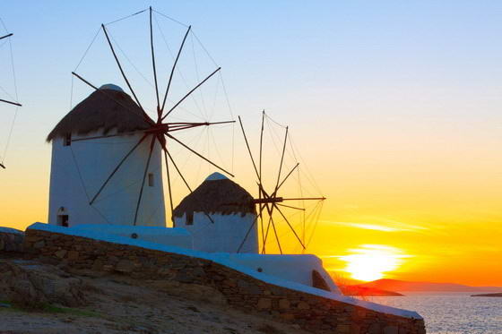 Mykonos Island, showing wind mils with a sunset, Greek Island Hopping vacation