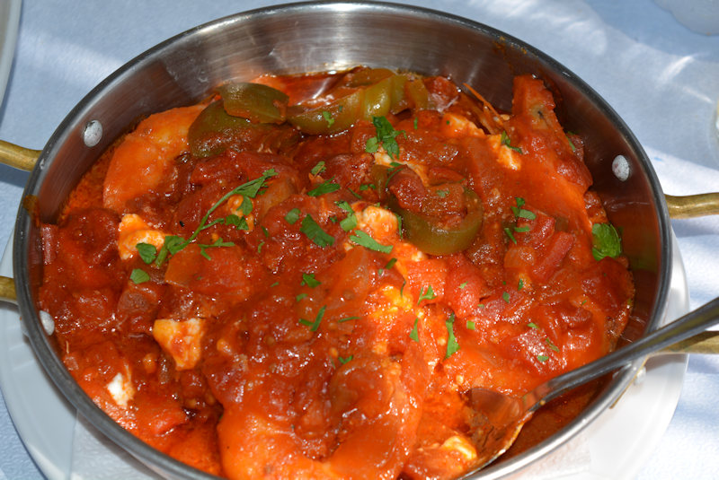 Greek Food, Saganaki. Shrimps with tomatoes, garlic, olive oil